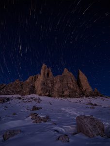 Long Exposure early morning starscape picture of the mountains and snow