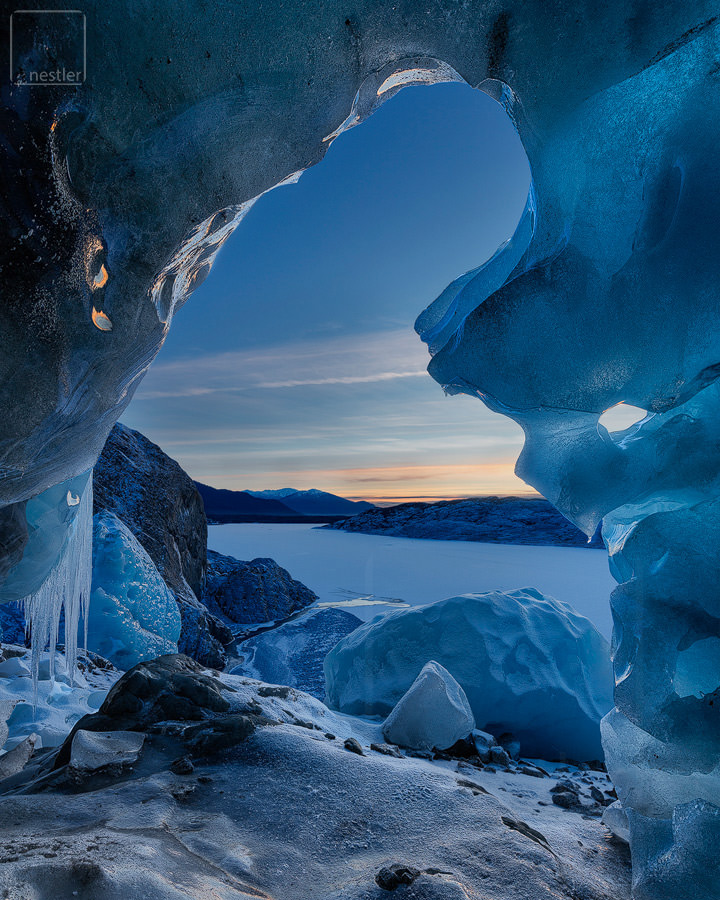 Door to Narnia - Sunset image from an ice cave under a glacier in Alaska