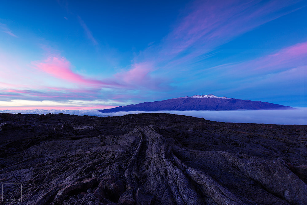Sunset from Mauna Loa looking toward Mauna Loa with pink clouds in the sky